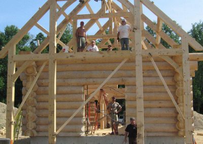 log cabin with timber frame roof structure